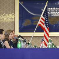 U.S. Ambassador Caroline Kennedy (second from left) and Lt. Gen. John Dolan, commander of the U.S. military in Japan (third from left) hold talks with Foreign Minister Fumio Kishida (second from right) and Defense Minister Gen Nakatani at the Foreign Ministry's Iikura Guesthouse in Tokyo on Tuesday. Japan, U.S. agree to narrow definition of 'civilian component' protected by SOFA