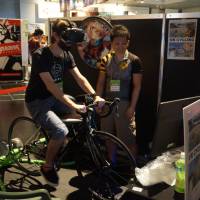 Pedaling VR: A visitor to this year's BitSummit games festival tries out VR Cycling, which uses VR headset and an actual bicycle. BitSummit reveals the reach of indie games