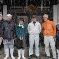 Ready for a brew: Philip Harper (center) and other members of Kinoshita Brewery in Kyoto. 'Kampai!' raises a glass to sake education