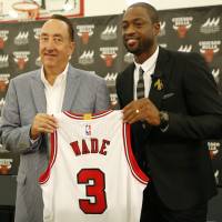 Chicago Bulls general manager Gar Forman (left) and Dwyane Wade are seen during the 12-time All-Star's introductory news conference on Friday in Chicago. Wade reflects on move to Bulls