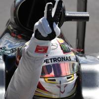 Mercedes driver Lewis Hamilton gestures to fans after winning the British Grand Prix on Sunday Hamilton closes gap on Rosberg with win