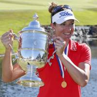 Brittany Lang holds the trophy after winning the U.S. Women’s Open on Sunday. Nordqvist penalty helps Lang win U.S. Women's Open