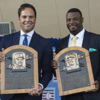New Hall of Famers Mike Piazza (left) and Ken Griffey Jr. pose with their plaques during their induction ceremony in Cooperstown, New York, on Sunday. Griffey Jr., Piazza inducted into Baseball Hall of Fame