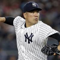Yankees starter Masahiro Tanaka pitches against the Red Sox on Sunday in New York. Tanaka outduels Price to lift Yankees over Red Sox