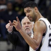 Tim Duncan, seen here with San Antonio Spurs coach Gregg Popovich, retired from the NBA after 19 seasons on Monday, and spoke out about his decision for the first time on Wednesday. Duncan gives thoughts on reason behind retirement