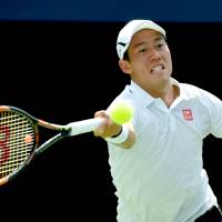 Kei Nishikori plays a shot from Grigor Dimitrov in their quarterfinal match at the Rogers Cup on Friday. Nishikori won 6-3, 3-6, 6-2. Nishikori makes Toronto semis