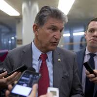 Sen. Joe Manchin, D-W.Va., talks with reporters June 20 on Capitol Hill in Washington. Manchin remained mum Wednesday as a pharmaceutical company run by his daughter faced mounting criticism for hiking prices on life-saving allergy injection pens. Sen. Manchin mum on daughter's drug firm amid EpiPen price spike uproar
