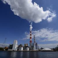 Steam rises from a plant in the Keihin industrial area of Kawasaki. Japanese factory output disappoints in July
