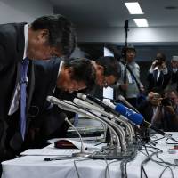 Mitsubishi Motors Corp. executives bow in apology during a news conference in April over a fuel economy scandal. Governance improves at Japan Inc., but scandals show compliance remains a challenge