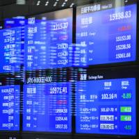 Electronic boards display market indices at the Tokyo Stock Exchange on June 27. On the TSE Mothers market, five of the top 10 biggest companies by market value are technology firms that began as ventures in universities. Nomura-Keio fund boosts investment target for domestic startups