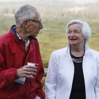Federal Reserve Chair Janet Yellen talks with Stanley Fischer, vice chairman of the Federal Reserve System's Board of Governors, on Friday at Jackson Lake Lodge in Grand Teton National Park, north of Jackson Hole, Wyoming. Yellen rejects radical overhaul of Fed's policy tools