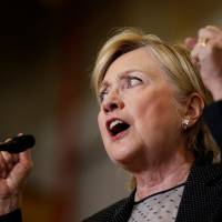 Democratic presidential nominee Hillary Clinton speaks Thursday at Futuramic Tool & Engineering in Warren, Michigan. Clinton vows to stand up to China, oppose TPP if elected