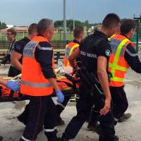 French firemen evacuate an injured passenger after a regional TER train rammed into a fallen tree in Saint-Aunes, France, east of Montpellier, Wednesday. Eight seriously hurt as French train hits hail-felled tree, terror panic ensues