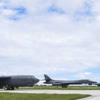 B-52 (left), B-1 (center) and B-2 bombers sit beside one another at Andersen Air Force Base, in Guam, on Wednesday. Amid North Korea, China tensions, U.S. says three key bombers simultaneously flying in Pacific for first time