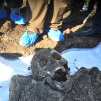 This photo released by the the Mass Graves Directorate of the Kurdish Regional Government shows a skeleton exhumed from a mass grave containing Yazidis killed by Islamic State militants in the Sinjar region of northern Iraq. An analysis by The Associated Press has found 72 mass graves left behind by Islamic State extremists in Iraq and Syria, and many more are expected to be discovered as the group loses territory. 72 mass graves documented as Islamic State continues genocide in Iraq, Syria