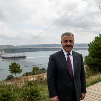 Turkish Transport Minister Ahmet Arslan stands near the newly built Yavuz Sultan Selim bridge over the Bosphorus in Istanbul, bridging Europe and Asia, on Tuesday. Mega-projects transforming Istanbul, linking Europe and Asia