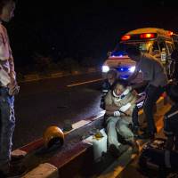 Vientiane Rescue volunteers help an injured motorcyclist in May following an accident under the influence of alcohol in Vientiane. Founded in 2010 by a group of foreigners, “Vientiane Rescue” is a much needed lifeline for those in need of urgent medical care where poorly maintained roads, dilapidated vehicles, an increase in motorcycle use and the widespread prevalence of drunk driving makes Vientiane one of Asia’s most precarious capitals for road deaths. In nation with almost no medical services, first aid volunteers save lives in Laos