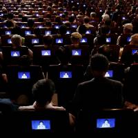 Audience members watch South Korean President Park Geun-hye deliver a speech at a ceremony marking the 71st anniversary of liberation from Japan's 1910-45 colonial rule, in Seoul on Monday. Park defends THAAD, urges North Korea to scrap its nuclear weapons