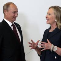 f russiatv-a 20160802Russian President Vladimir Putin meets in 2012 with then-U.S. Secretary of State Hillary Clinton on her arrival at the APEC summit in Vladivostok, Russia. During her recent acceptance of the Democratic party nomination to run for the U.S. presidency, Clinton said Russia is an enemy and cannot be trusted, a statement that clearly stung the Kremlin and seems to have heralded a new era for the coming presidency if Clinton wins. For Kremlin's thoughts on Clinton, look no further than Russian state TV