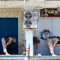 Libyan forces pray as they prepare for next advance against Islamic State holdouts in Sirte, Libya, Monday. Libyan forces 'liberate' last of two Islamic State pockets in Sirte
