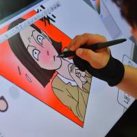 North Korean defector Choi Sung-guk edits his weekly online comic cartoon called Rodong Simmun (Labor Interrogation) at his office in Seoul on Aug. 9. A North Korean defector shares his life — in online cartoon