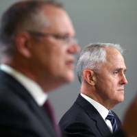 Australian Prime Minister Malcolm Turnbull (right) and Treasurer Scott Morrison address reporters in Sydney on Wednesday. Apparent cyberattacks forced the government to shut down its first attempt at an online census. Australia shuts down online census over cyberattacks