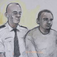 This courtroom sketch by artist Elizabeth Cook shows Zakaria Bulhan, right, appearing at Westminster Magistrates Court in London, Saturday. The 19-year-old Somali-Norwegian man is accused of carrying out a deadly stabbing rampage in London’s Russell Square. U.K. police charge 19-year-old with London stabbings