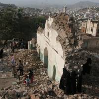 People gather among the rubble of a Sufi mosque that was blown up in an attack in the southwestern city of Taiz, Yemen, Saurday. There were no casualties and no groups have claimed responsibility for the attack, according to local media. Yemen Islamists blow up famed 16-century mosque in Taiz