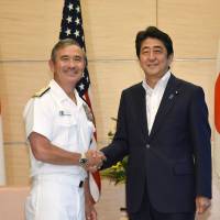 U.S. Pacific Command head Adm. Harry Harris is welcomed by Prime Minister Shinzo Abe during a courtesy call at Abe's official residence in Tokyo on July 26. Abe denies conveying concern to U.S. commander over 'no first use' nuke policy