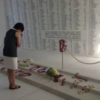 This photo posted on Akie Abe's Facebook account shows her at the USS Arizona Memorial in Honolulu on Monday. She paid respects to victims of the Pearl Harbor attack by Imperial Japanese forces on Dec. 7, 1941. Akie Abe prays at Pearl Harbor, fueling speculation Japan's prime minister will follow suit
