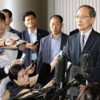 New Japanese Ambassador to South Korea Yasumasa Nagamine speaks with reporters upon arriving at Gimpo International Airport in Seoul on Thursday. New ambassador to South Korea expects ties to improve once sex slave row solved