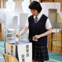 An 18-year-old high school student casts a ballot in the Upper House election in Sendai on July 10. Japan high school teachers walk fine line in teaching politics