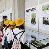 Elementary school children look at panels describing U.S. President Barack Obama's May visit to Hiroshima at Hiroshima Peace Memorial Museum on July 1. Obama's Hiroshima visit has student advocates hoping for more