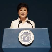 South Korean President Park Geun-hye delivers a speech on Korean Liberation Day, which marks the end of Japanese colonial rule in 1945, at the Seong Cultural Center in Seoul on Monday. Park stresses future with Japan but lawmakers focus on past with Takeshima visit