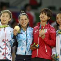 Japan's Ami Kondo (second from right) holds her bronze medal alongside the other medalists in the women's 48-kg judo competition at the Rio Olympics on Saturday. Judoka Kondo wins Japan's first medal of Rio Games