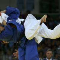 Masashi Ebinuma throws Canada's Antoine Bouchard during the men's 66-kg bronze-medal match at the Rio Olympics on Sunday. Japan misses judo gold again as Ebinuma, Nakamura take bronze