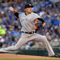 New York’s Masahiro Tanaka pitches during the Yankees’ 5-4 win over the Royals on Tuesday. Yankees edge Royals after strong outing by Tanaka