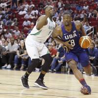 Team USA's Harrison Barnes drives on Nigeria's Michel Umeh during an exhibition game in Houston on Monday night. The U.S. won 110-66. Team USA routs Nigeria in final Olympic tuneup