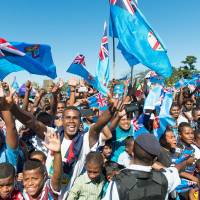 Fans greet Fiji’s Olympic gold-medal-winning men’s sevens rugby team on its return from Rio de Janeiro, at Prince Charles Park in Nadi, Fiji, on Sunday. The government has declared a national holiday for Monday to celebrate the nation’s first-ever Olympic medal. Fiji rugby sevens team receives hero's welcome upon return home