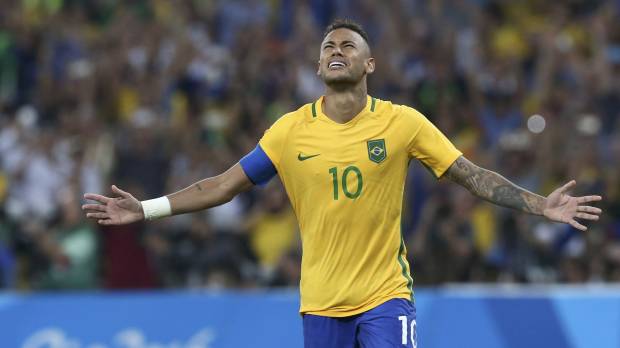 Brazil forward Neymar celebrates after scoring the winning penalty in the shootout against Germany in the men’s soccer final at the Rio Olympics at Maracana Stadium on Saturday. Brazil beats Germany on penalties to win first-ever Olympic soccer gold