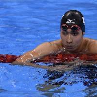 China's Sun Yang (left) celebrates next to Kosuke Hagino after winning the 200-meter freestyle final on Monday night. Hagino struggles in 200m freestyle final, places seventh