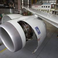 The Rolls Royce Holdings PLC logo is displayed on an engine of a Boeing Co. 787-9 Dreamliner at Air New Zealand's technical operations base at Auckland International Airport in 2014. ANA to seek Rolls-Royce redress for 787 flight cancellations over turbine flaws
