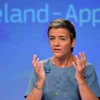European Commissioner Margrethe Vestager gestures during a news conference on Ireland's tax dealings with Apple Inc. at the European Commission in Brussels Tuesday. Apple penalty spotlights corporate giants' vast untaxed profits offshore, but U.S. can retaliate with 1934 law