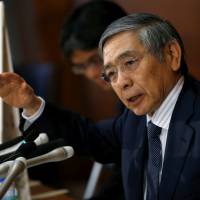 Bank of Japan Gov. Haruhiko Kuroda attends a news conference at the BOJ headquarters in Tokyo on Wednesday following its Policy Board meeting. BOJ shifts policy framework to target Japan's yield curve