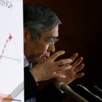 Bank of Japan Gov. Haruhiko Kuroda attends a news conference at BOJ headquarters in Tokyo on Wednesday. Kuroda's strategy shifts from shock and awe to bond market finesse