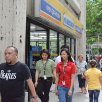 A Ministop store serves middle-income earners in Manila's business district. Japanese convenience stores are expanding fast across Asia. Japanese convenience stores are storming into Asia, where demand is strong for nation's service culture