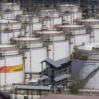 Oil storage tanks sit at an oil refinery operated by Rosneft OAO in Tuapse, Russia, in May. As rivals circle, Japan boosts firepower to buy global energy assets