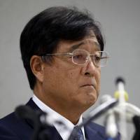 Mitsubishi Motors Corp. Chairman Osamu Masuko listens to a reporter's question during a news conference at the troubled automaker's headquarters in Tokyo on Aug. 2. Mitsubishi Motors stays in cross hairs as Nissan rescue falls behind