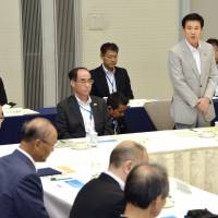 Chiba Gov. Kensaku Morita addresses a meeting Tuesday in the city of Chiba on bolstering the functions of Narita International Airport. New 3,500-meter runway proposed for Narita International Airport