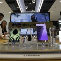 Samsung Electronics Galaxy Note 7 smartphones are displayed at the company's showroom in Seoul on Saturday. Samsung shares tumble on Note 7 fire warnings